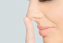 Why do we breathe harder through one nostril on our nose?