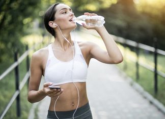 Stomach Exercises For A Flatter Tummy A young fit woman with flat stomach