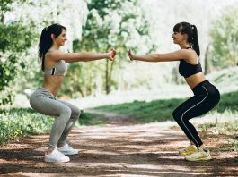 Two fit women warming up-cooling down
