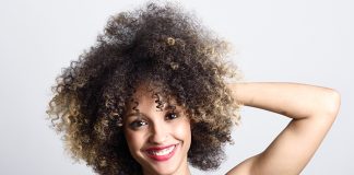 Beautiful smiling woman with curly hair